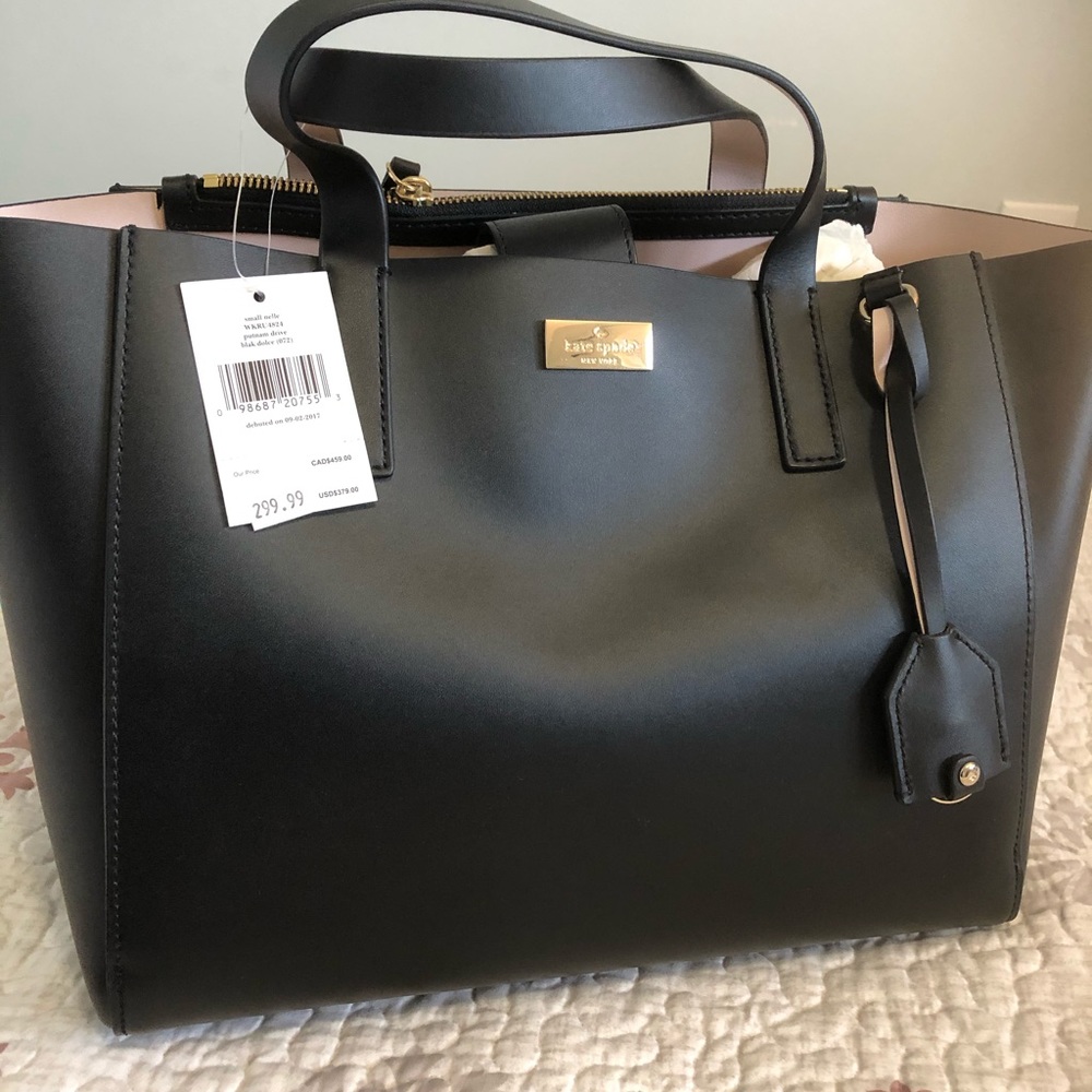 Kate spade satchel style bag with long strap .